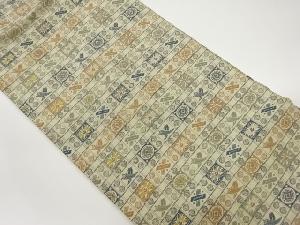 格子に七宝・宝・草花模様織出し名古屋帯